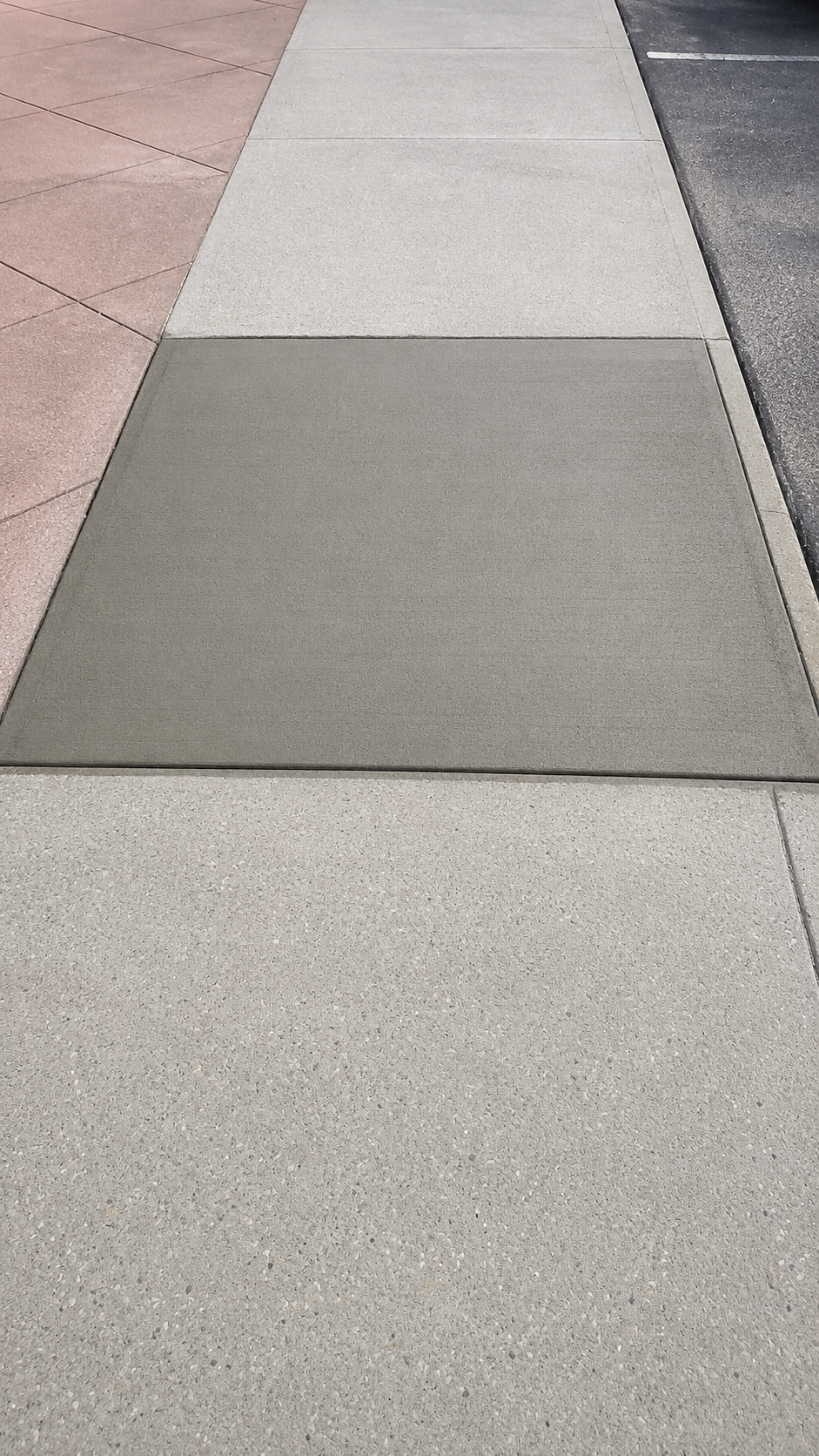 Concrete sidewalk panel patch repair with clean edge finish
