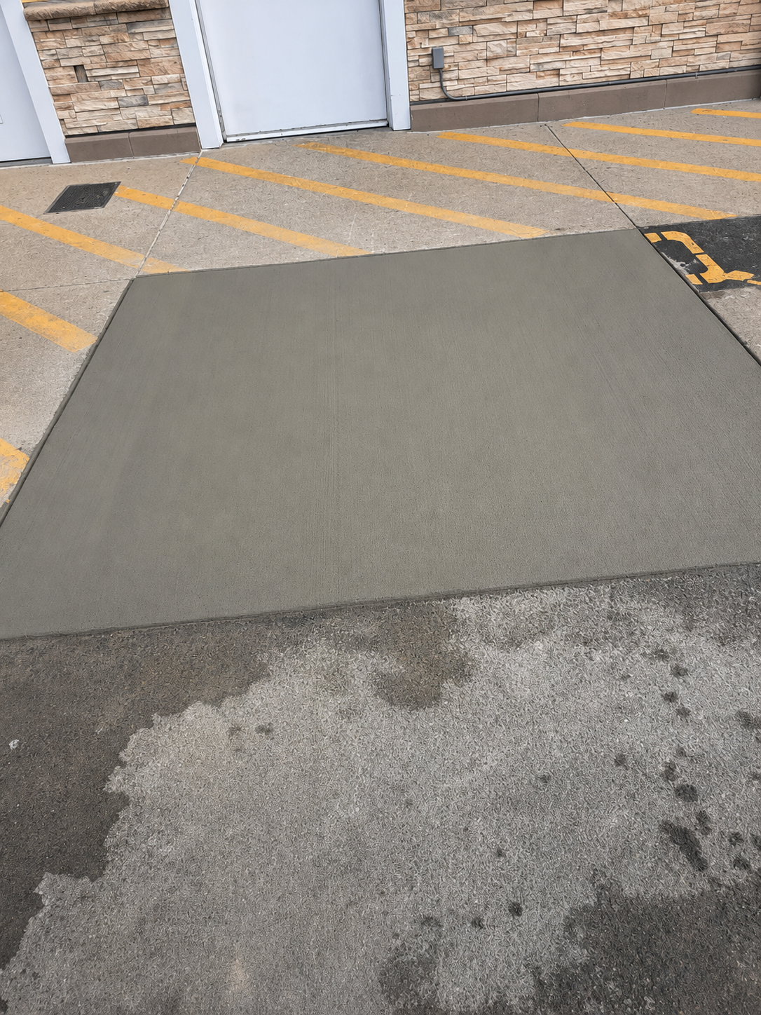 Commercial parking lot apron repair showing clean, finished concrete
